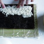 Cover whole nori with sushi rice