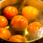 Tomatoes in boiling-water