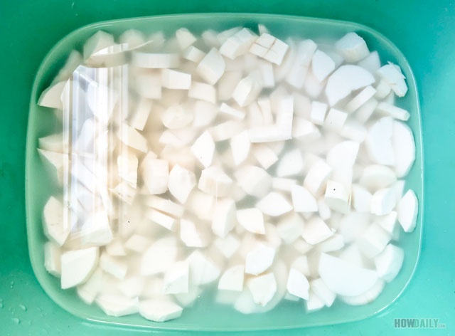 Soaking yuca root in water