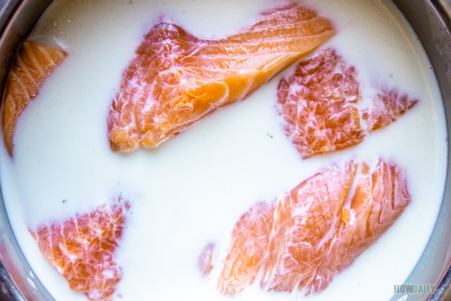 Soak salmon with whole milk and salt